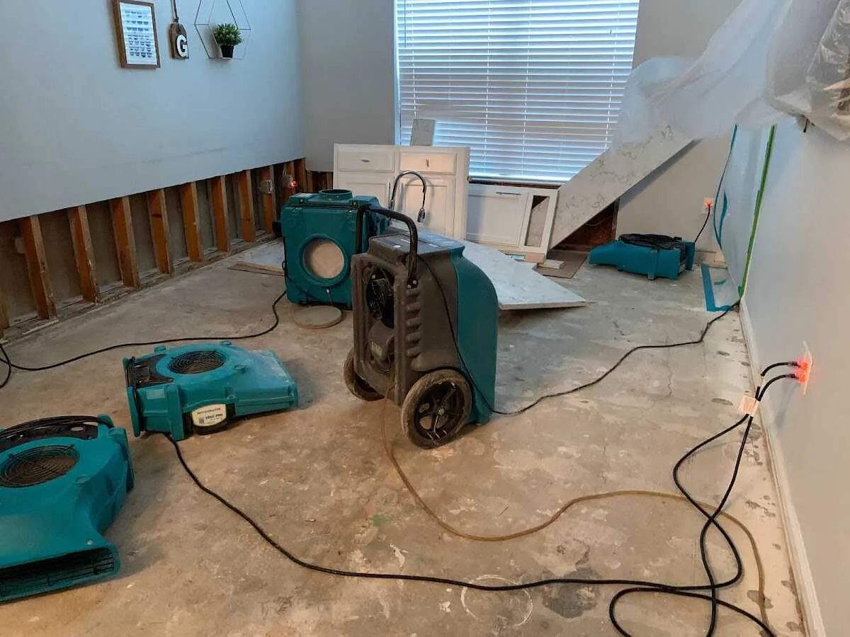 Dehumidifier in flood-cut room for Water Damage Restoration in East Highland Park